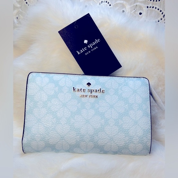 kate spade Handbags - Kate Spade wallet- spade flower pvc color blue glow with gold accents.